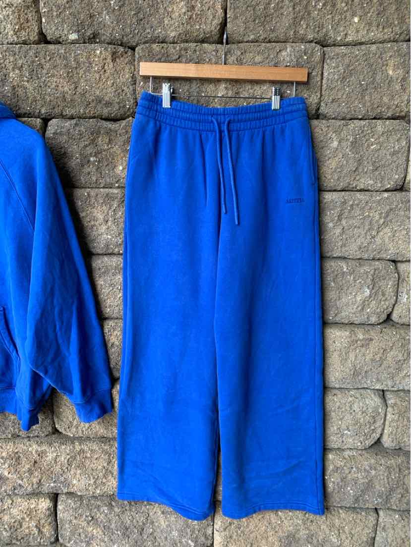 Bright blue wide-leg pants with elastic waistband and drawstring, soft fabric, casual style.