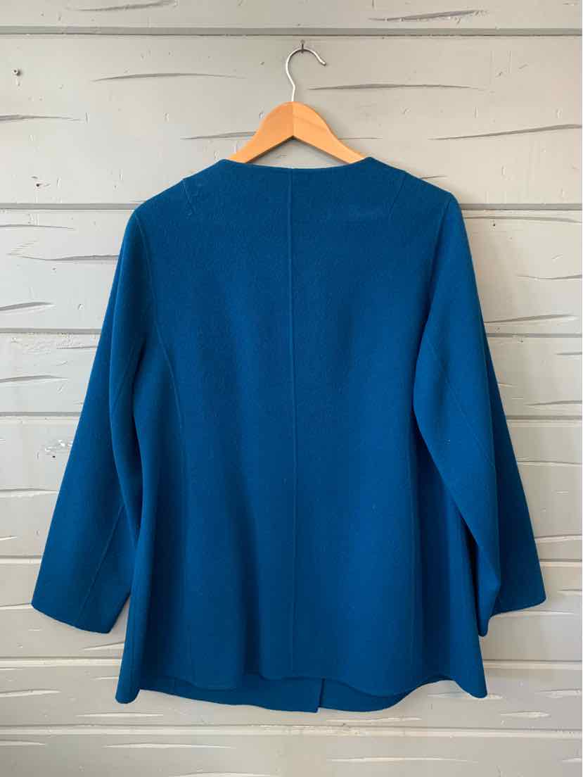 Blue long-sleeve open-front cardigan with relaxed fit, displayed on wooden hanger.