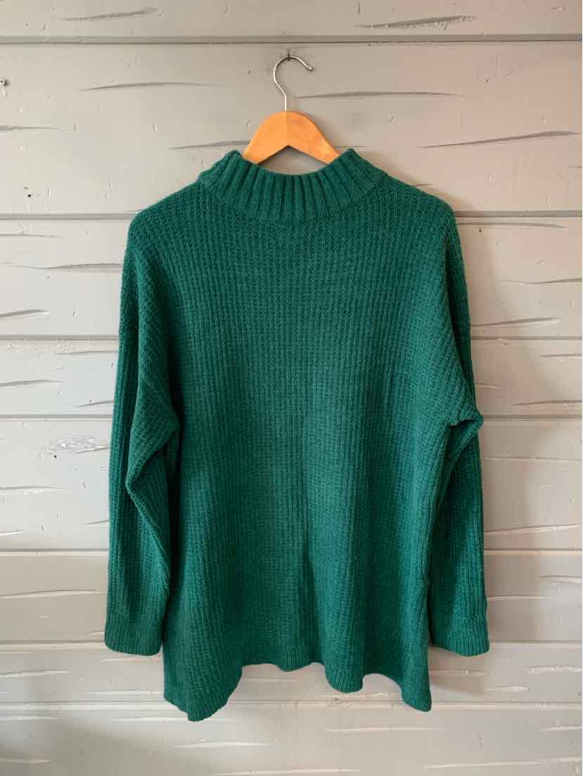 Green oversized knit sweater with ribbed mock neck and long sleeves.