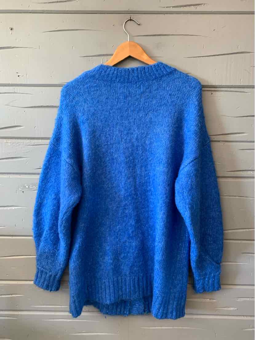 Bright blue long-sleeve knit sweater with a relaxed fit, ribbed cuffs, hem, and crew neckline.