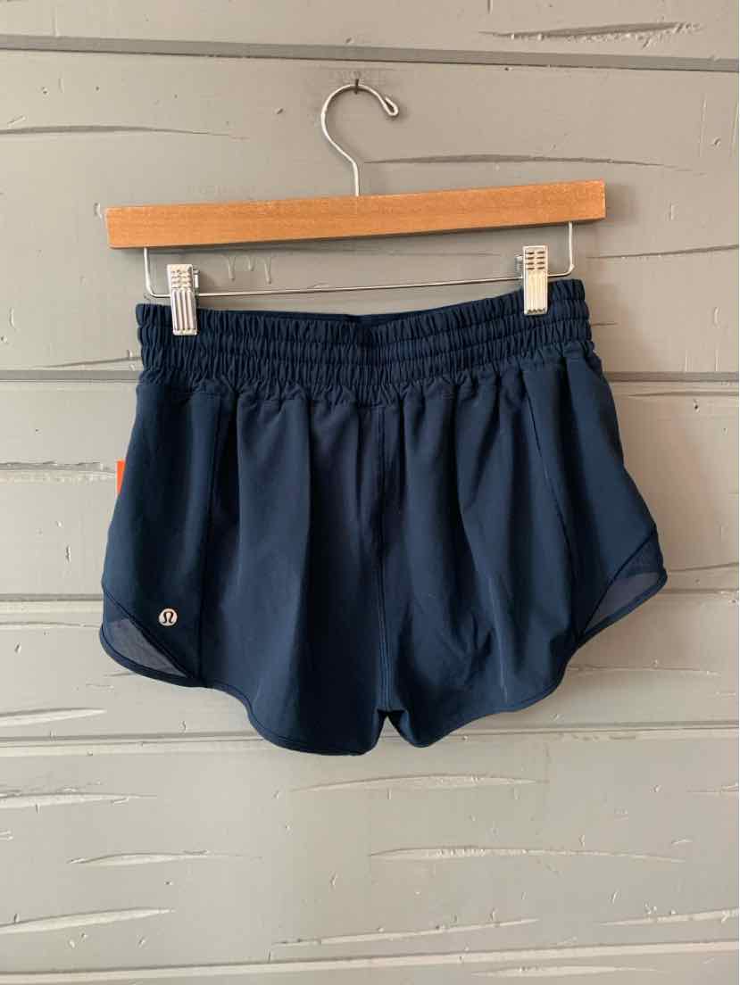 Navy blue lightweight athletic shorts with elastic waistband and small logo on left hem.