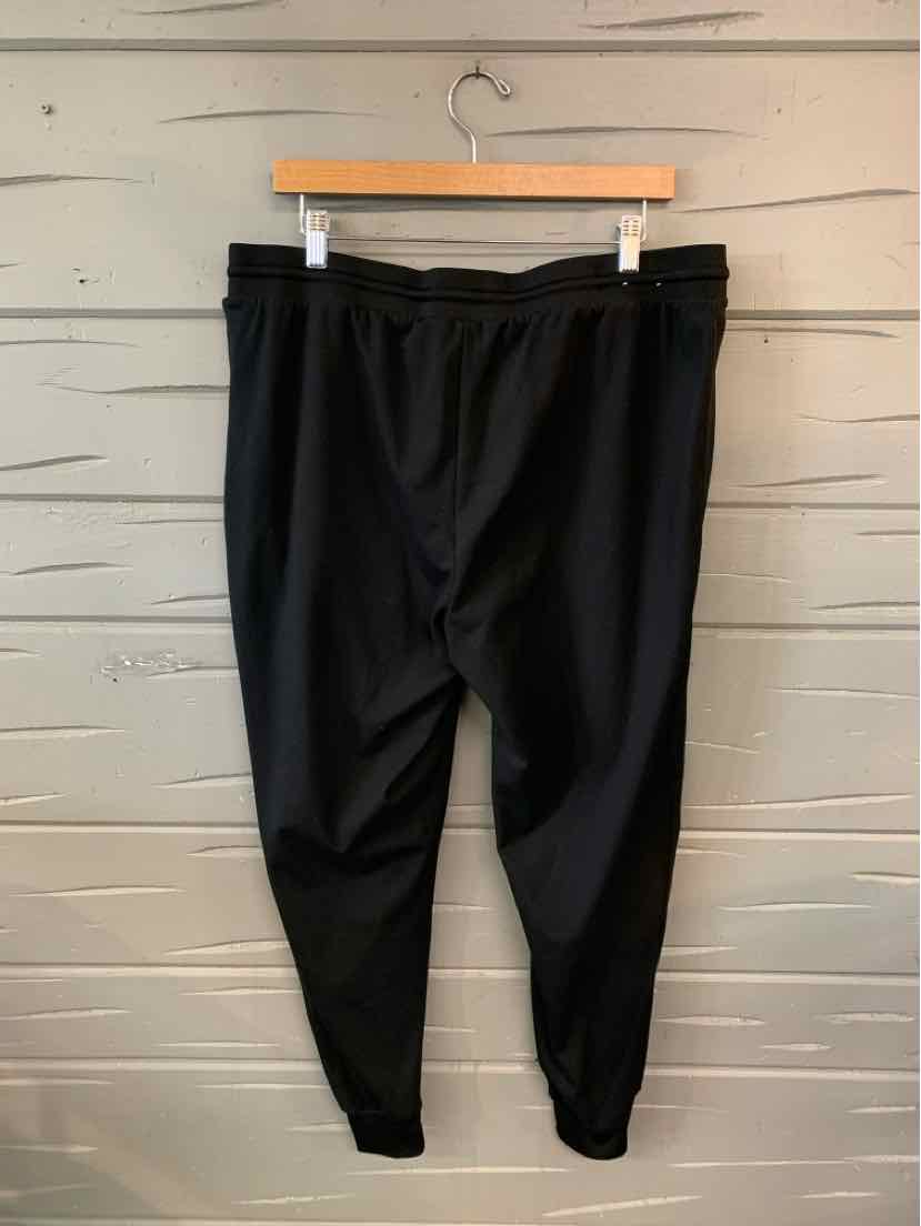 Black tapered jogger pants with elastic waistband and cuffed ankles, size XL.