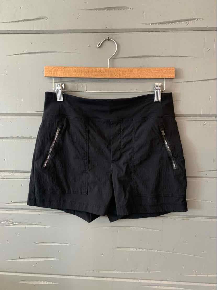 Black athletic shorts with zippered side pockets, lightweight fabric, and a fitted waist, size 2.