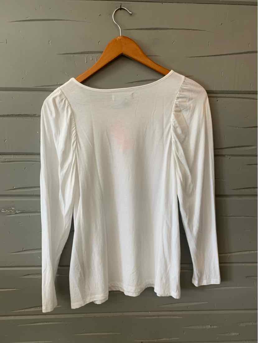 White long-sleeve women's top with scoop neckline and gathered shoulder details hanging on wooden hanger.
