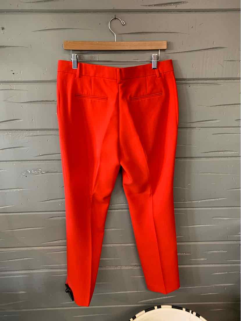 Bright red tailored ankle-length pants with back pockets and belt loops, size 10P.