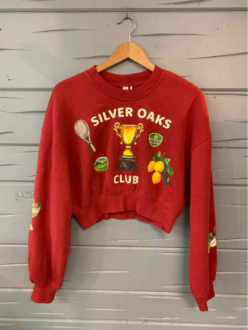 Red cropped long-sleeve sweatshirt with a Silver Oaks Club graphic, tennis racket, trophy, and fruit motifs.