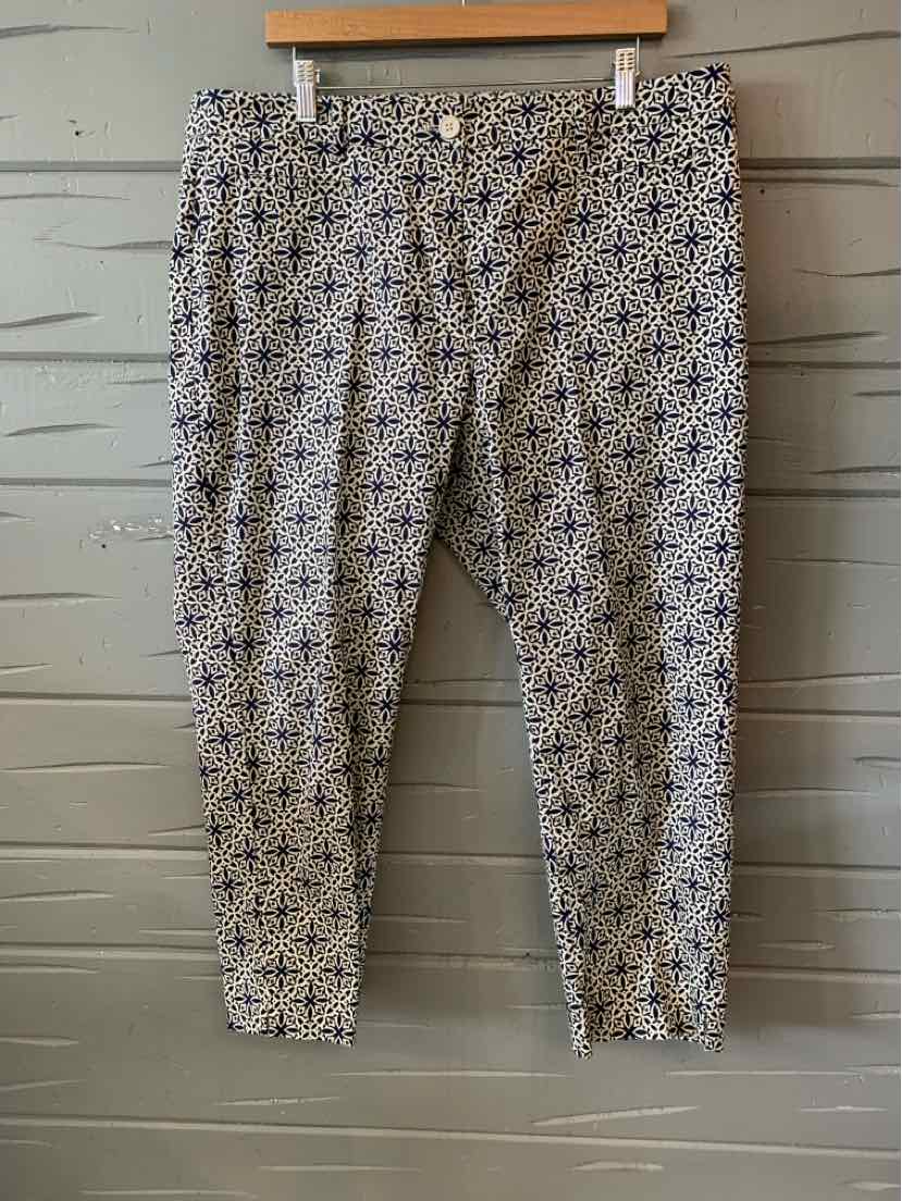 Womens size 16 pants with black and white geometric pattern and tapered legs hanging on hanger.