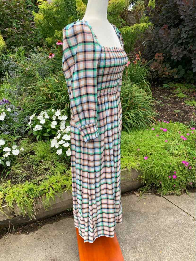 Plaid midi dress featuring pastel blue, pink, and white colors with long puffed sleeves and a square neckline.