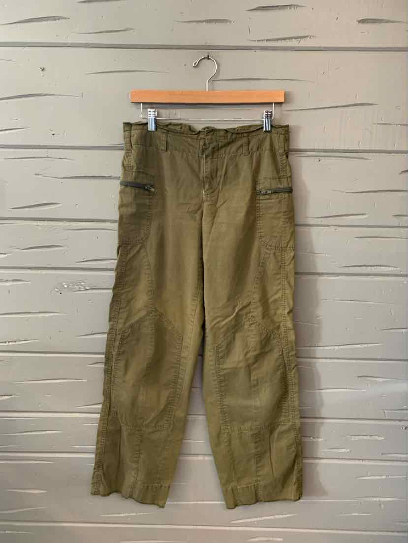 Olive green cargo pants with drawstring waist and large side pockets, loose fit and straight legs.