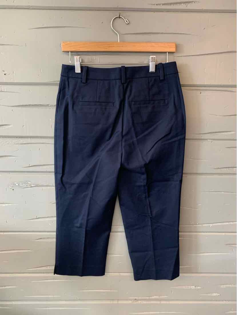 Navy blue slim-fit trousers with back pockets and a straight leg cut in size 4.