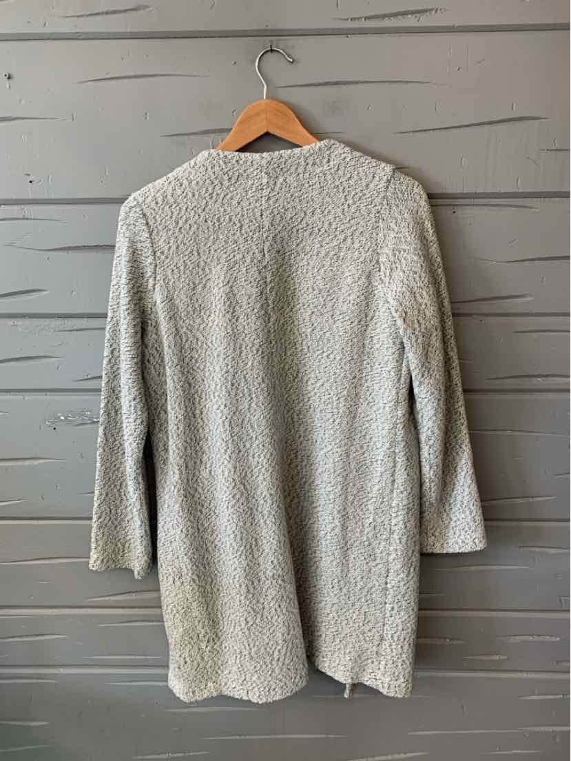 Light gray knit long-sleeve sweater dress in size XS hanging on wooden hanger.