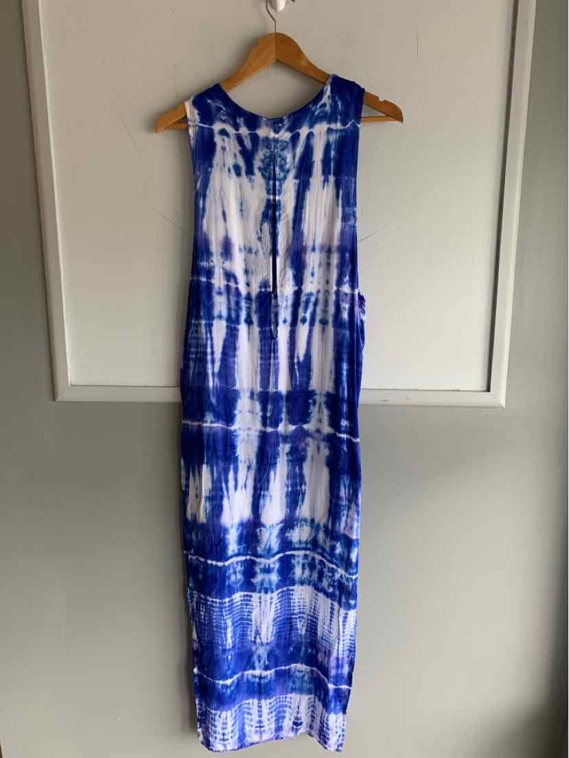 Sleeveless blue and white tie-dye maxi dress with scoop neckline hanging on wooden hanger.
