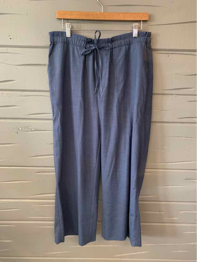 Navy blue wide-leg pants with elastic waistband and drawstring, lightweight fabric.