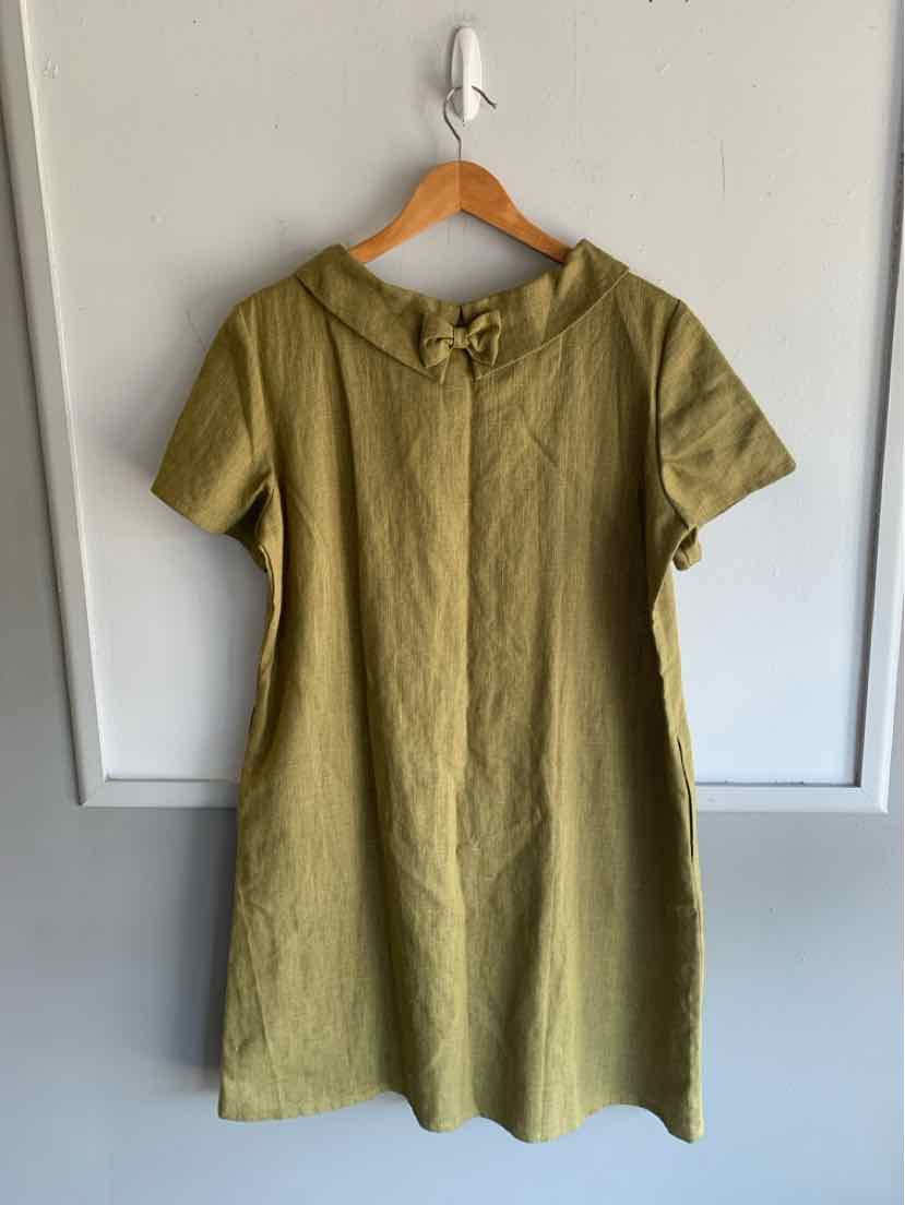 Olive green short-sleeve dress with rounded collar and front button placket, A-line silhouette.