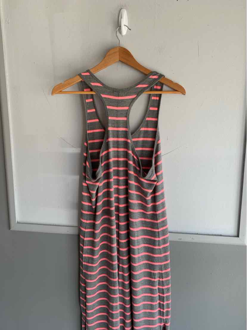 Gray and light green striped sleeveless dress with racerback design on wooden hanger.