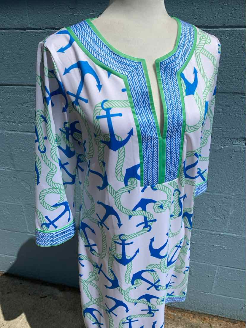 White tunic dress with blue and teal anchor print and green embroidered neckline, medium size.