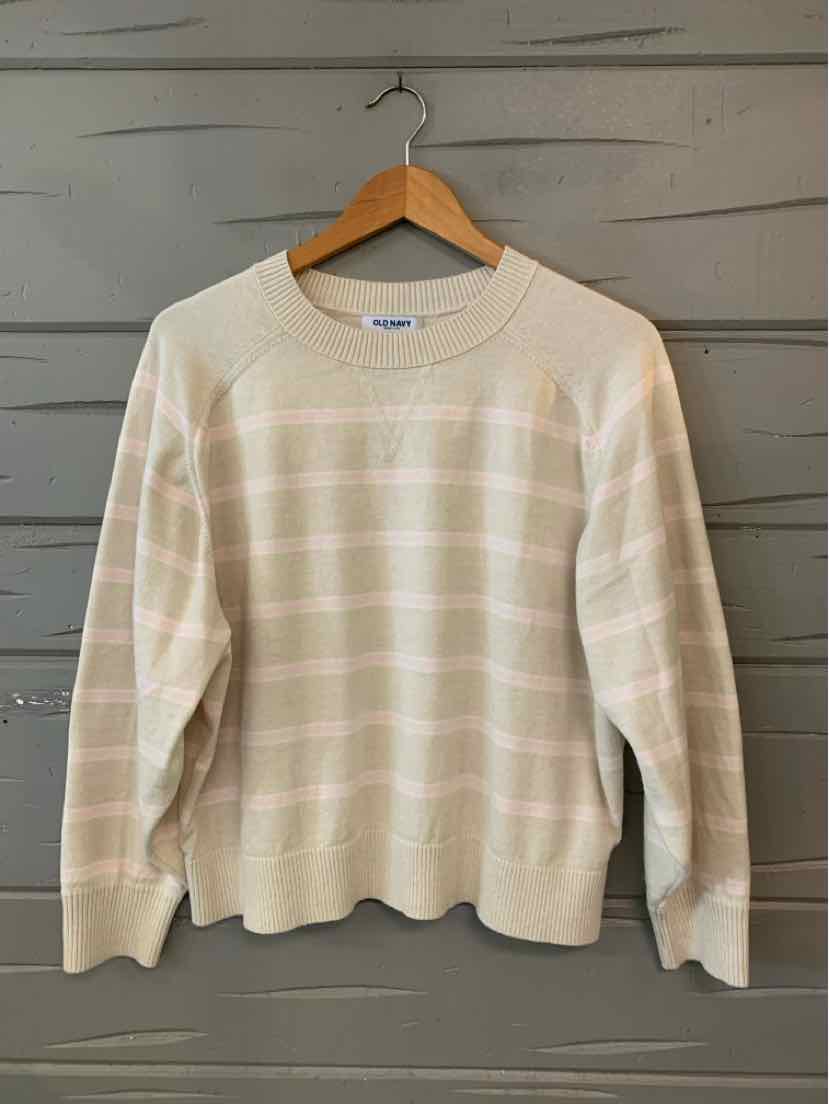 Beige long-sleeve knit sweater with subtle horizontal white stripes and ribbed cuffs and hem.
