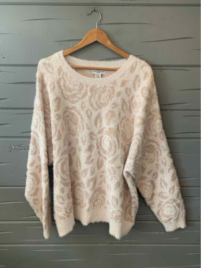 Soft pink oversized sweater with textured floral pattern and long sleeves, size 3X.