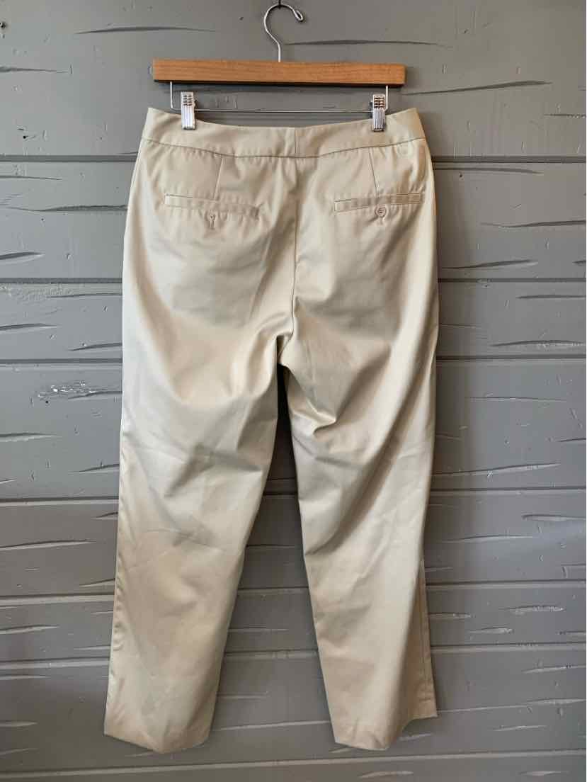 Tan straight-leg pants with back pockets, mid-rise waist, and smooth cotton fabric, size 8.