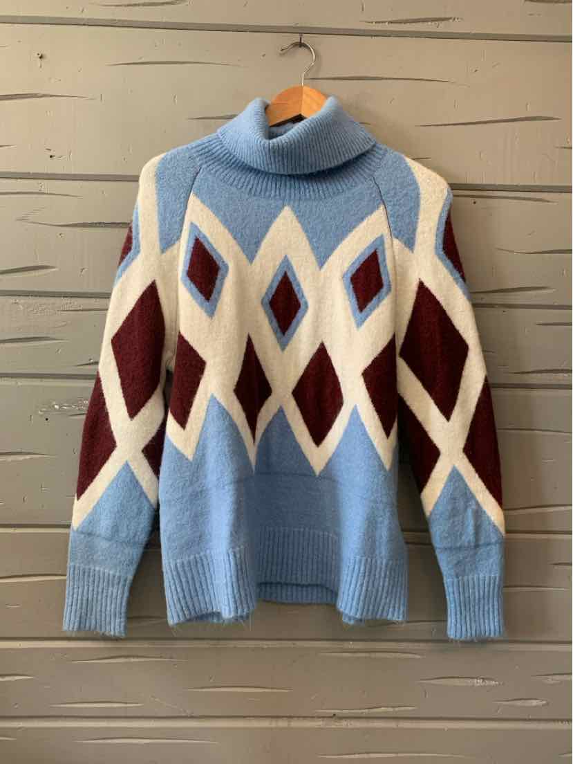 Light blue knit J.Crew turtleneck sweater with burgundy and cream diamond patterns and ribbed cuffs.