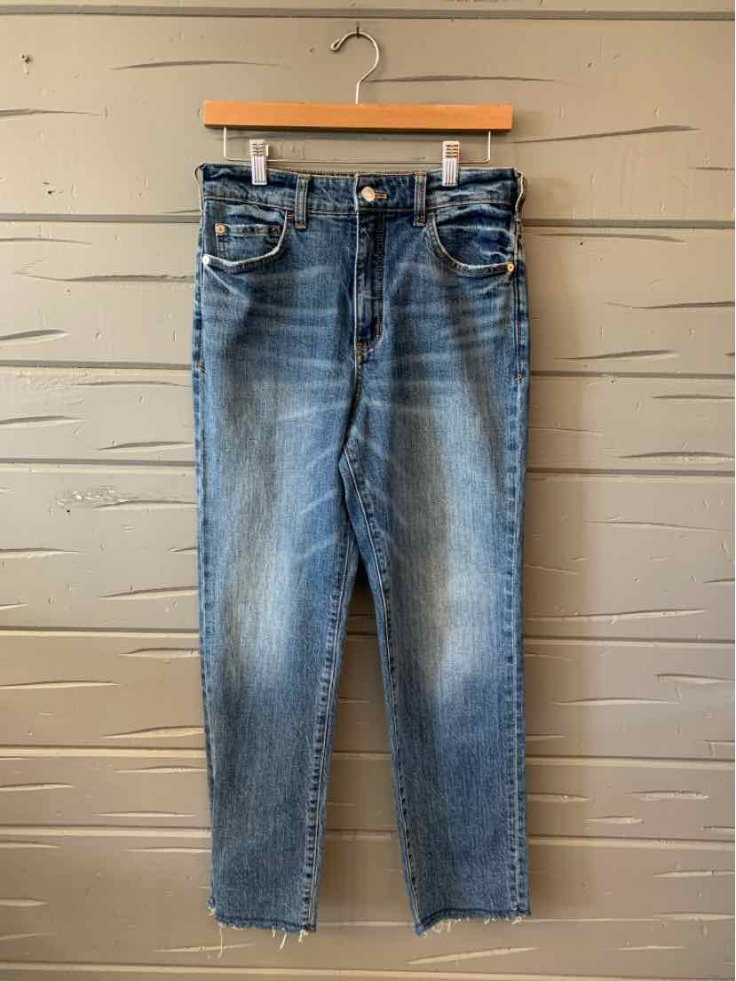 Blue washed straight-leg jeans with faded whiskering, contrast stitching, and a button-fly waist.