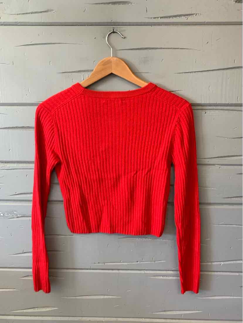 Bright red ribbed knit long-sleeve sweater with a fitted silhouette and crew neckline.