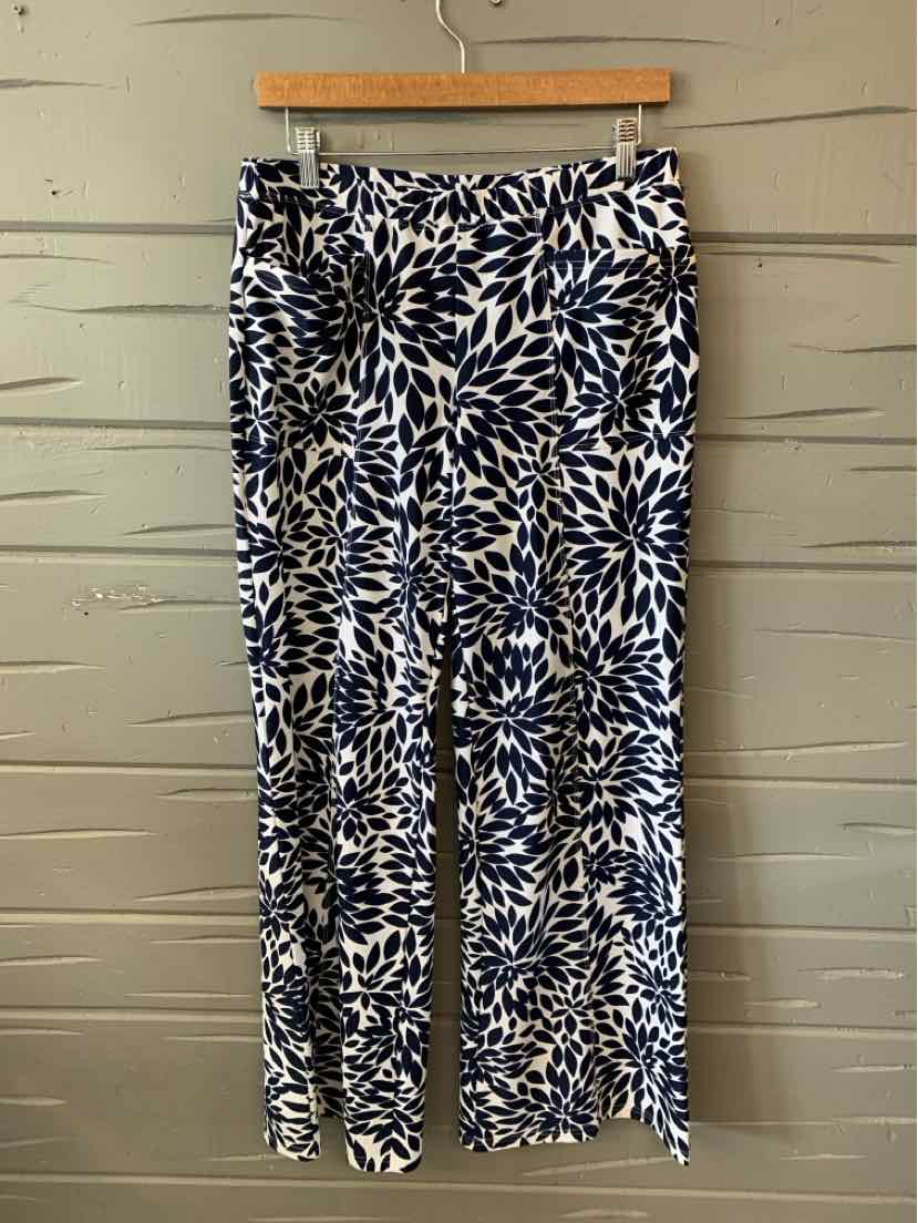 Navy and white wide-leg pants with abstract leaf pattern and elastic waistband.