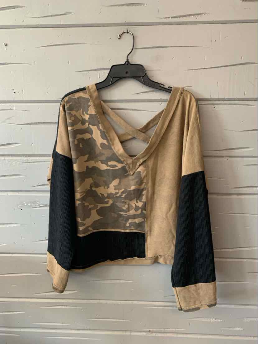 Women's cropped pullover with tan and green camo block pattern, black sleeves, and V-neck back straps.