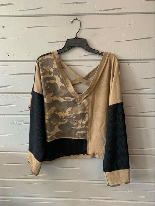 Women's cropped pullover with tan and green camo block pattern, black sleeves, and V-neck back straps.