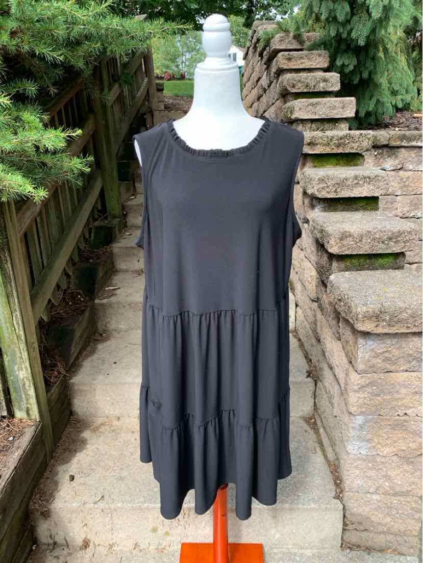 Black sleeveless tiered dress with scoop neckline, loose fit, and lightweight fabric.