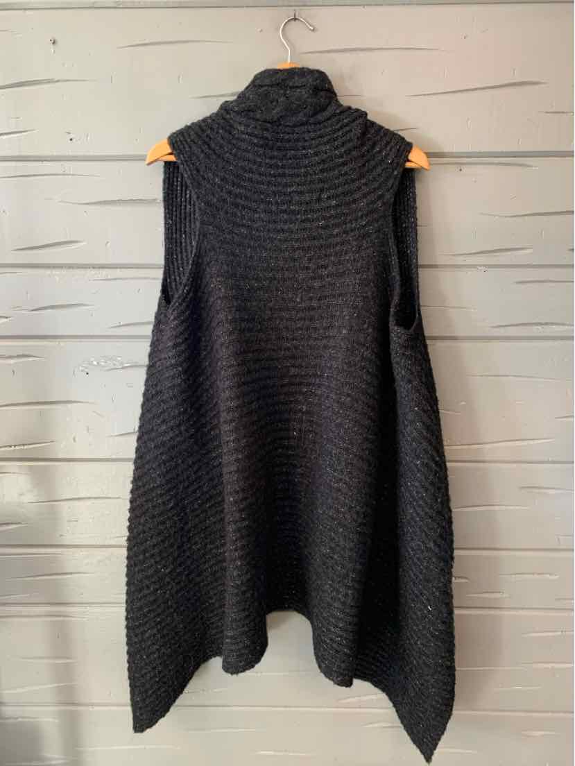 Dark charcoal gray chunky-knit sleeveless vest with a high cowl neck and long pointed draped hem.