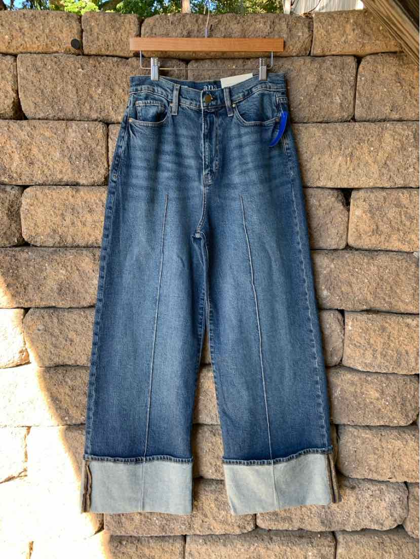 Women’s blue denim jeans with a relaxed straight-leg fit, cuffed hems, and visible front pockets.