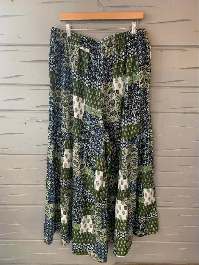 Green and navy patchwork skirt with white floral accents, tiered and flowy, size 18/20.
