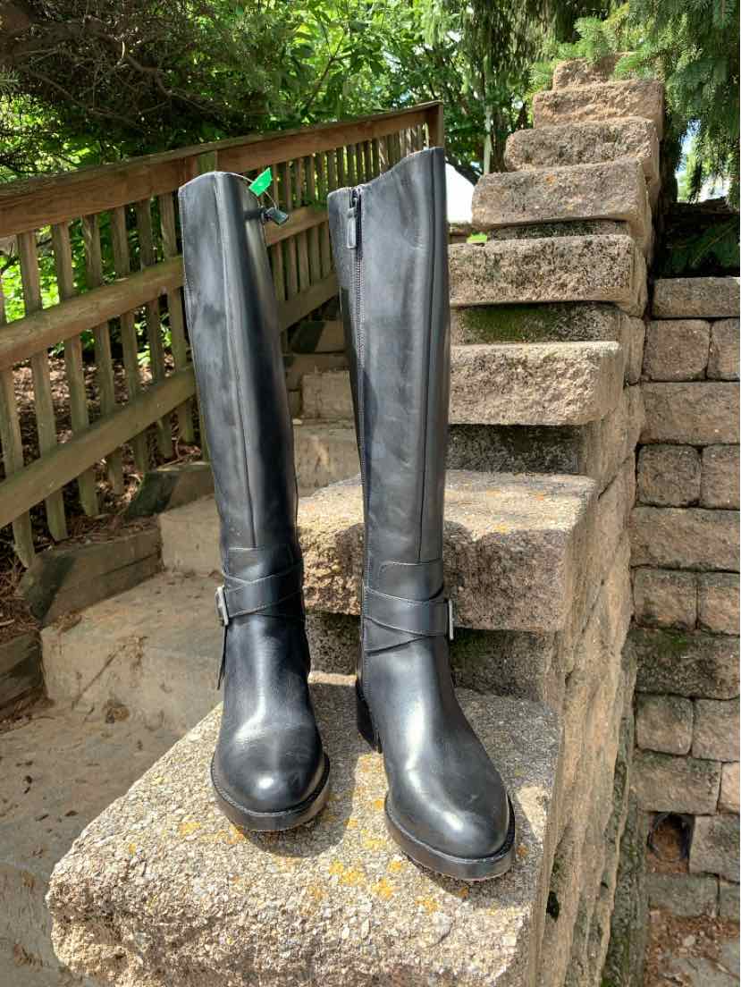 Black leather knee-high boots with rounded toes and stacked heels, size 5.5.