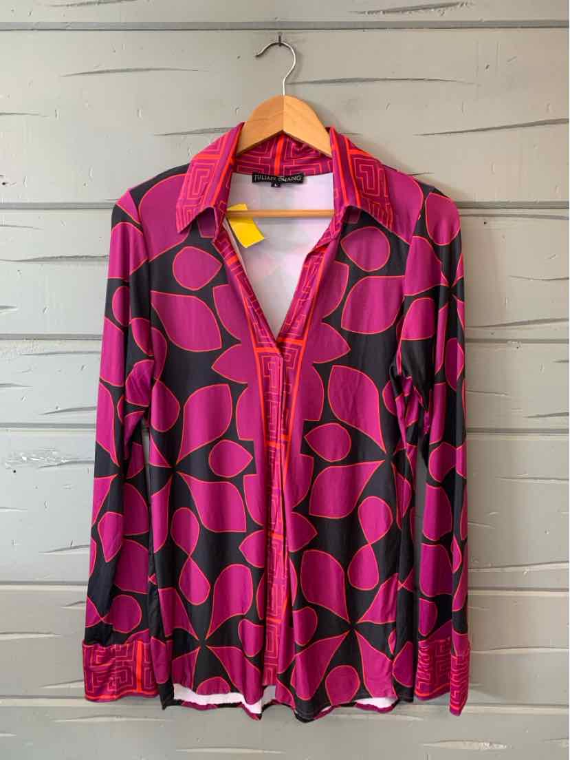 Long-sleeve blouse with large magenta and black geometric leaf pattern, pointed collar, and red trim detailing.