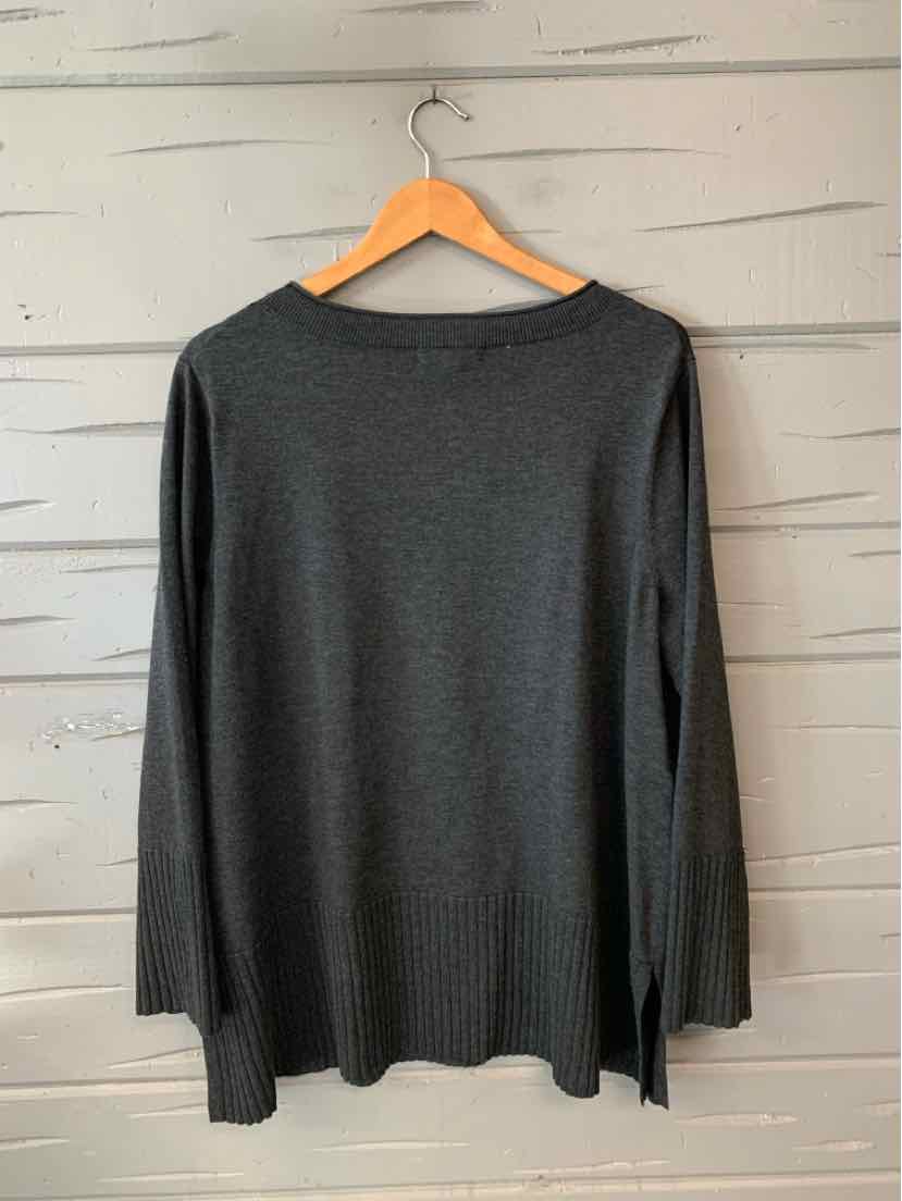 Dark gray long-sleeve knit sweater with crew neckline, hanging on wooden hanger.
