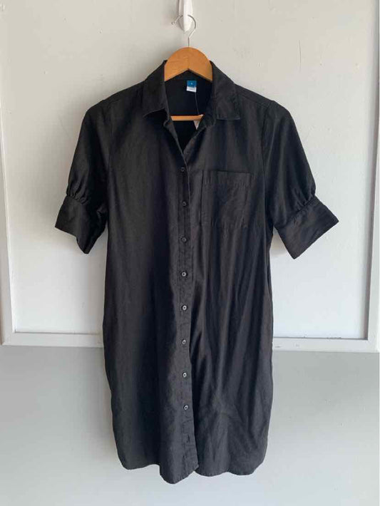 Black short-sleeve button-down shirt dress with collar and chest pocket.
