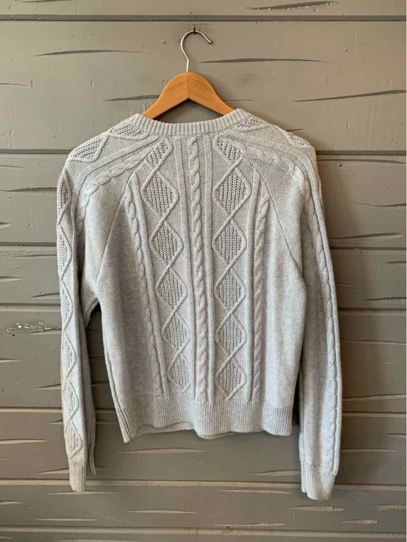 Light gray cable knit sweater with diamond and braided patterns, long sleeves, and ribbed cuffs and hem.