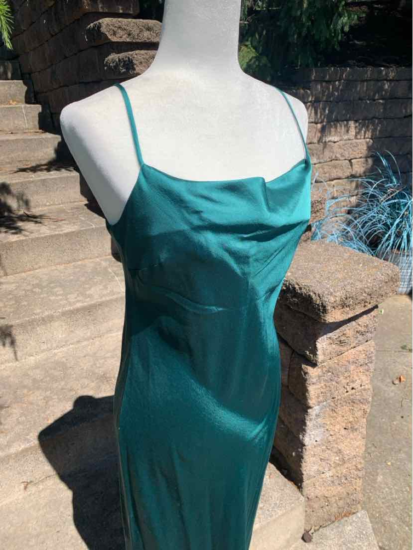 Teal satin midi slip dress with thin spaghetti straps and a cowl neckline.