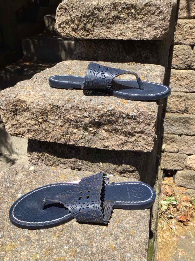 Navy blue leather Tory Burch NY sandal with perforated logo detail and flat sole, size 6.