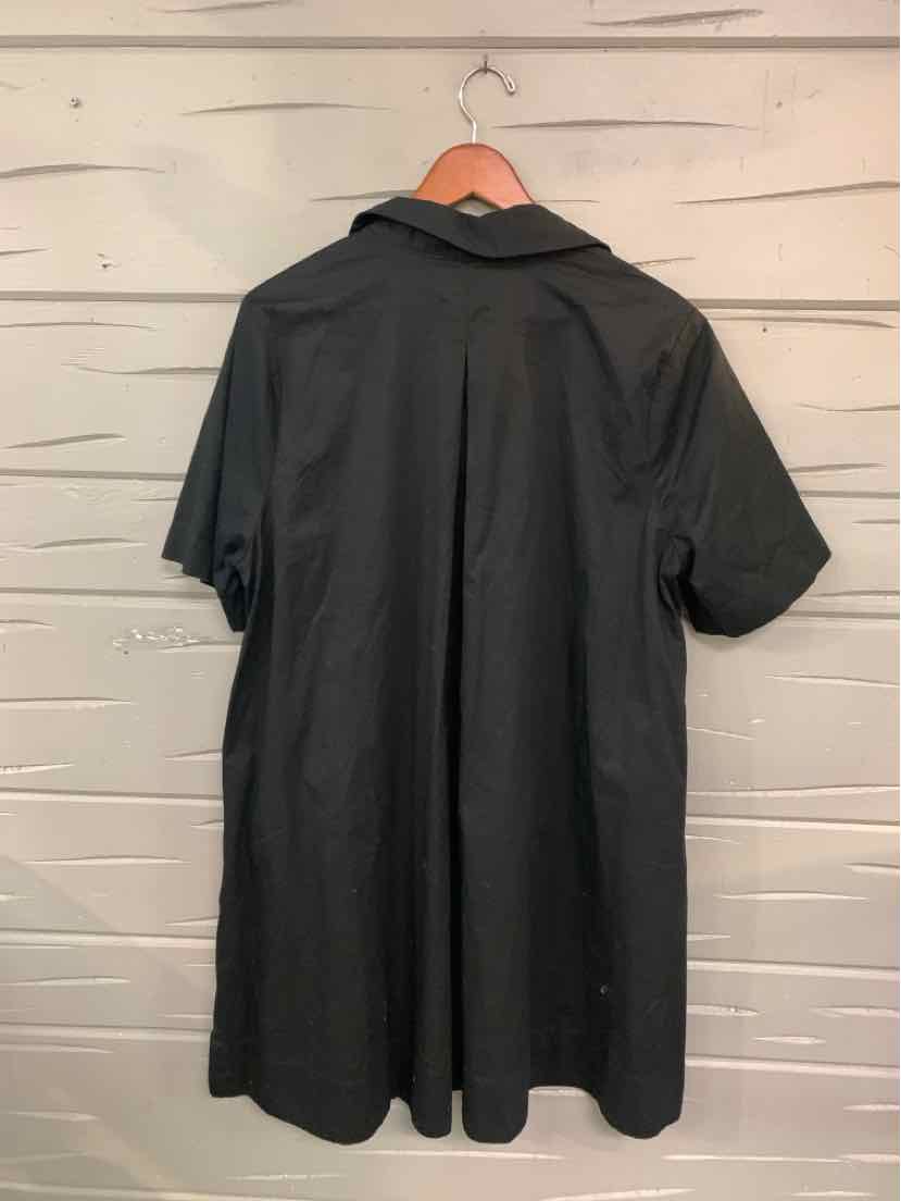Black short-sleeve collared dress with relaxed fit and straight hem hanging on wooden hanger.