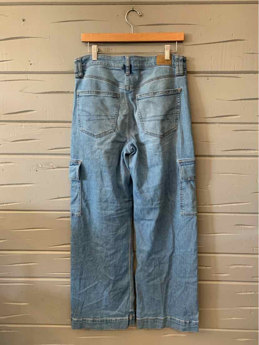 Light blue American Eagle denim jeans with a faded wash, relaxed straight legs, and front pockets, hanging flat.