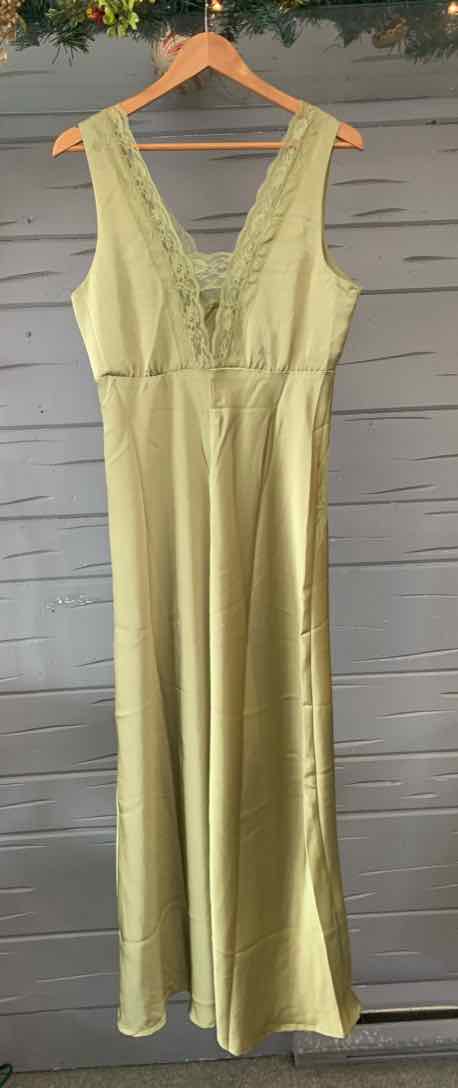 Light green sleeveless maxi dress with V-neck and lace trim on hanger.