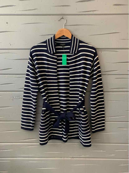 Navy and white striped long-sleeve cardigan with waist tie and collar on wooden hanger.