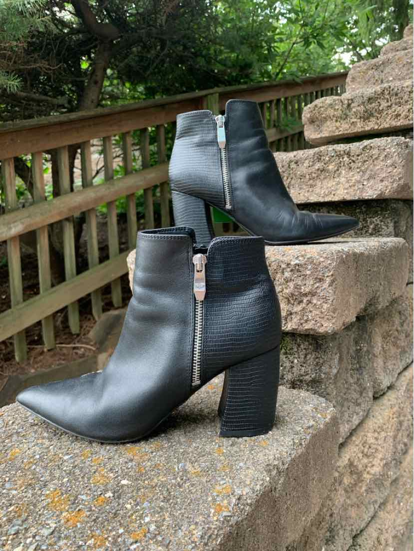 Black leather ankle boots with pointed toes and chunky block heels, side zipper detail.