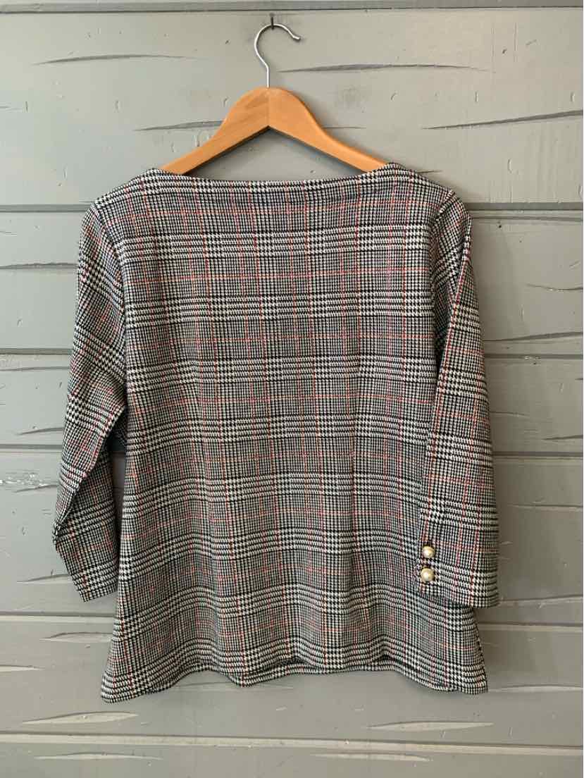 Womens long-sleeve blouse with black and gray houndstooth pattern, tailored fit, and gold button details on sleeves.