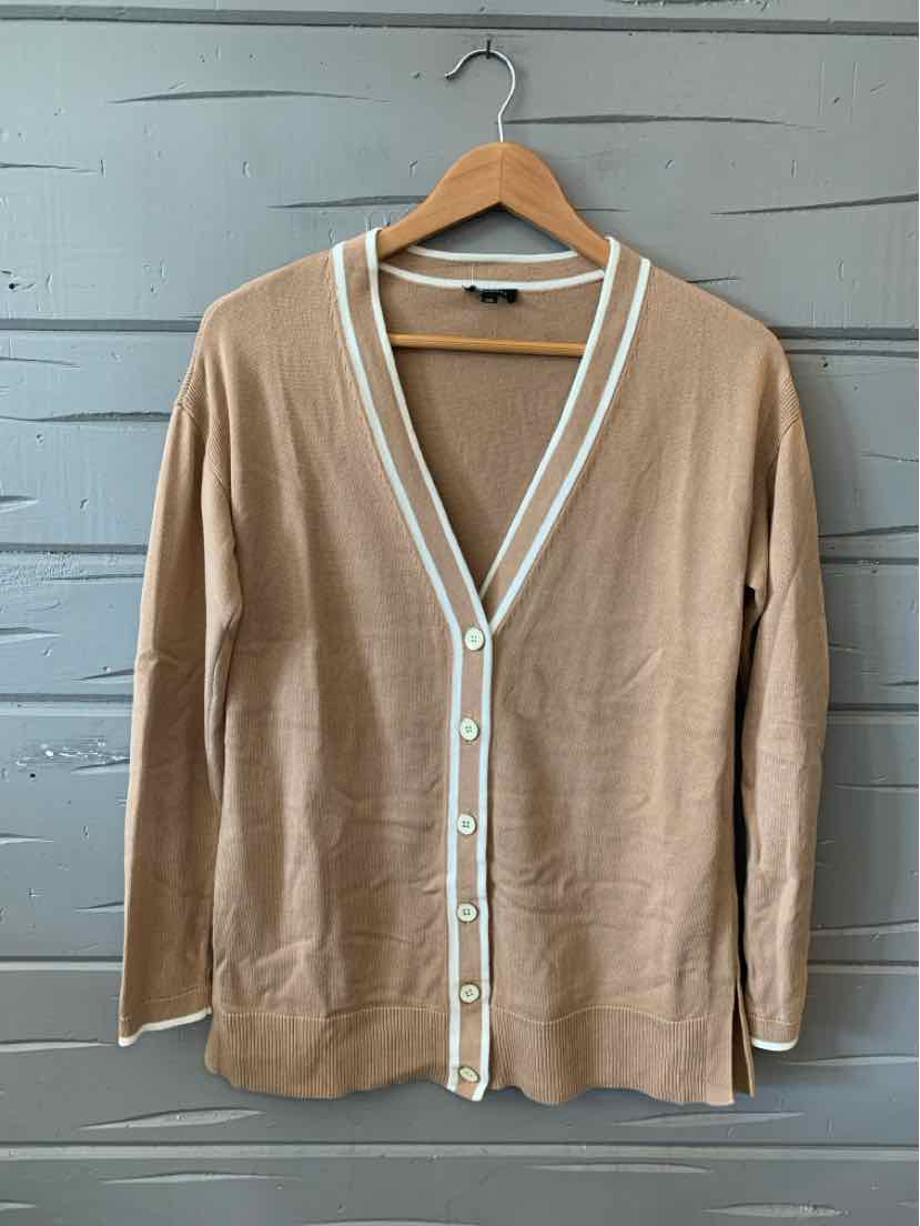 Tan long-sleeve cardigan with white trim and button-down front in size XS on wooden hanger.