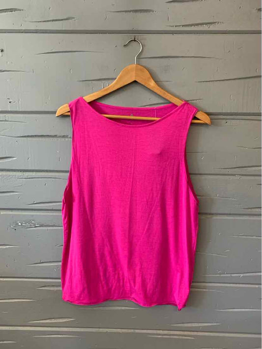 Bright pink sleeveless athletic tank top with a relaxed fit on wooden hanger.