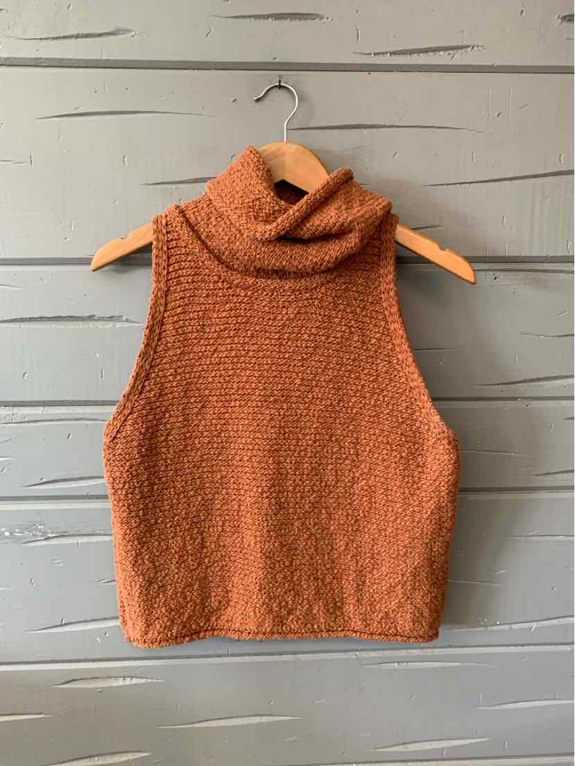 Tan sleeveless knit sweater with high turtleneck collar, loose fit, and textured fabric.