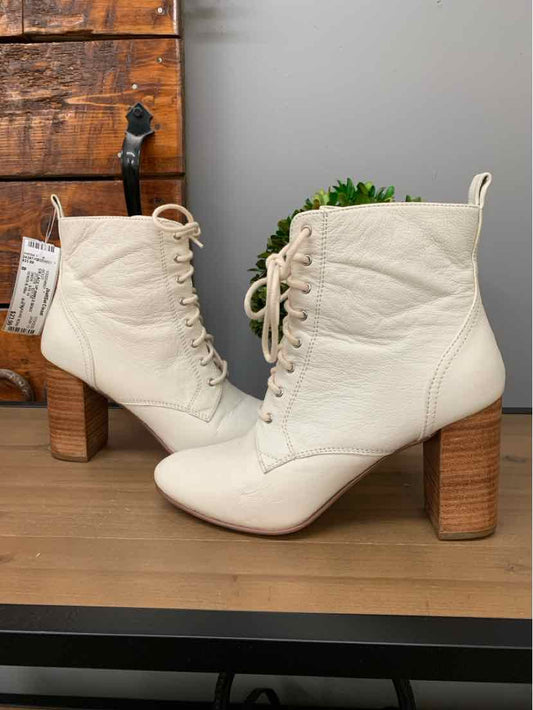 Cream white lace-up ankle boot with quilted leather and stacked wooden block heel.